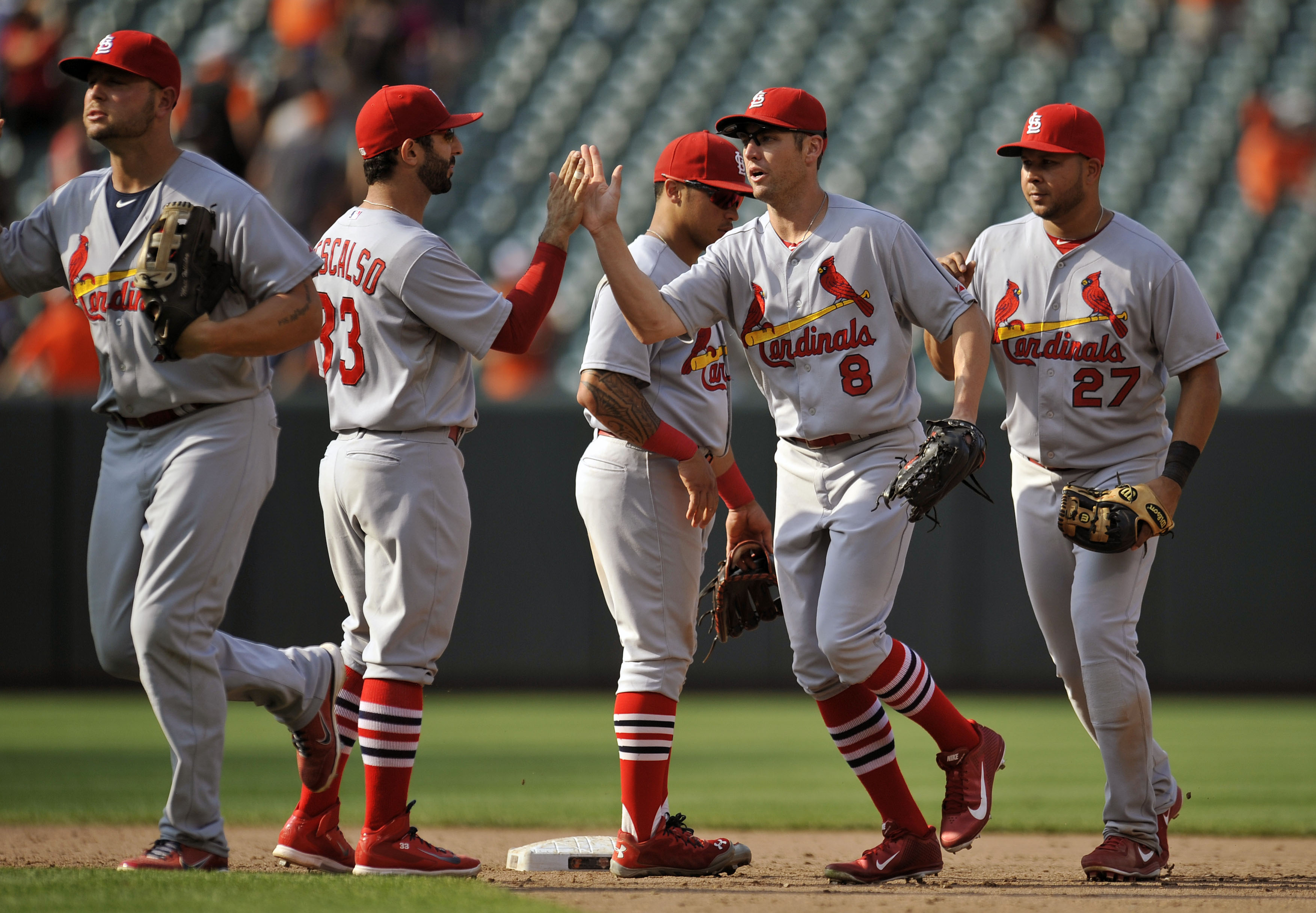 Jon Jay of the St. Louis Cardinals, left, celebrates with teammate