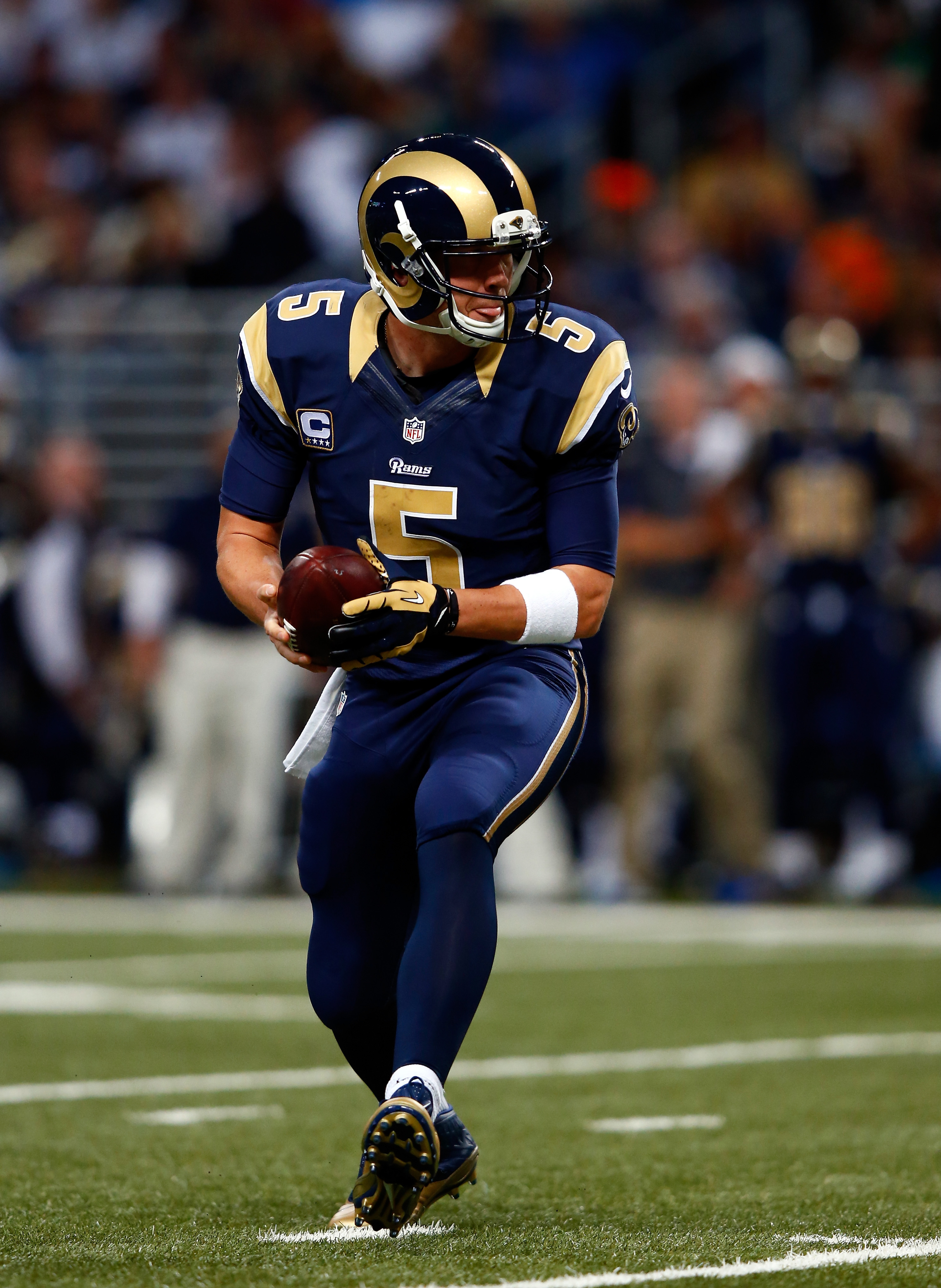 Quarterback Nick Foles of the St. Louis Rams walks off the field