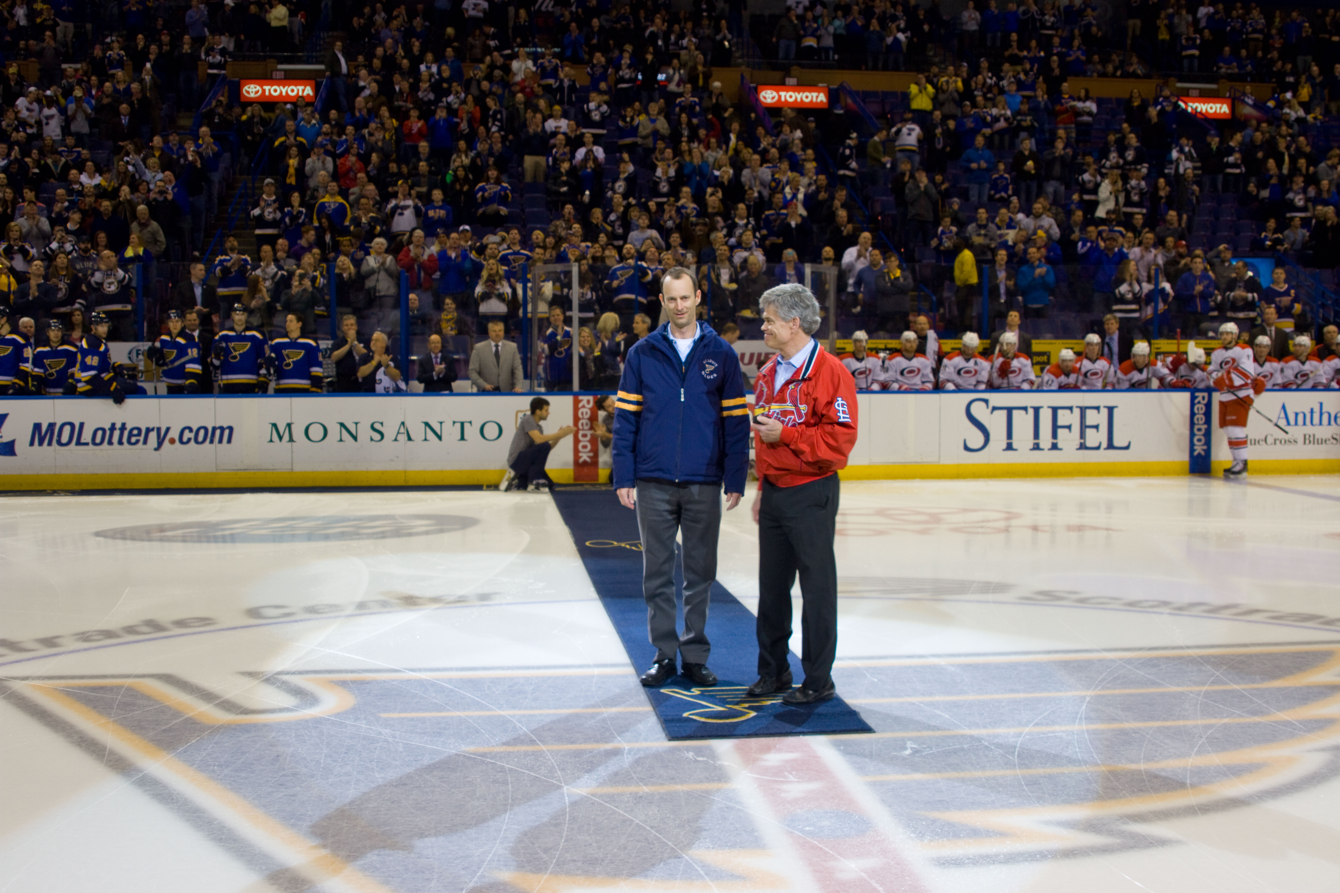 St. Louis Blues Chairman Tom Stillman (R) and St. Louis Cardinals President  Bill DeWitt III prepare for a ceremonial puck drop before the St. Louis  Blues-Carolina Hurricanes hockey game at the Scottrade