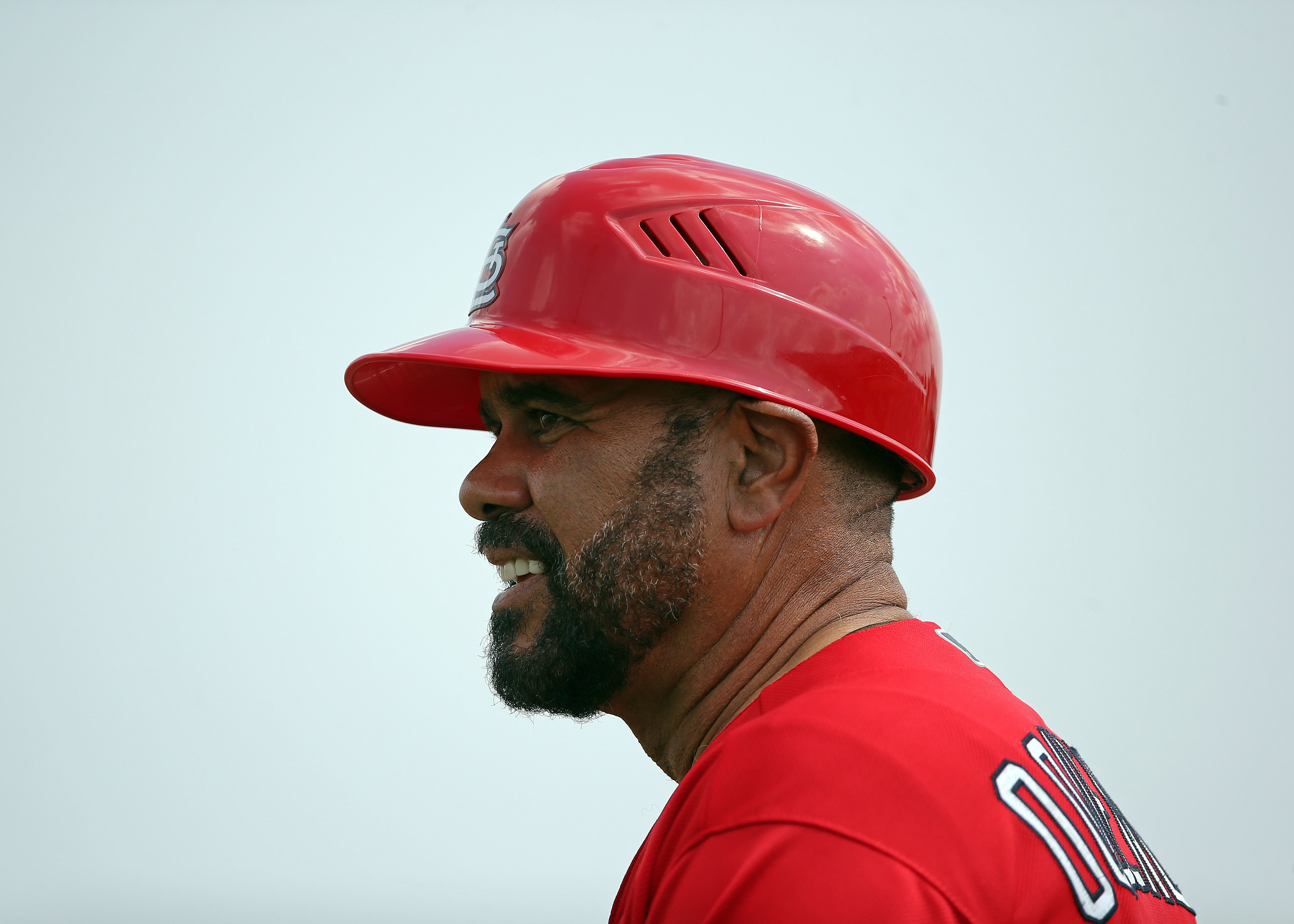 St. Louis Cardinals third base coach Jose Oquendo walks in the