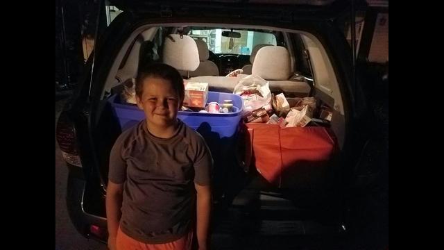 8-year-old boy helps stock food pantry's empty shelves - KSDK.com