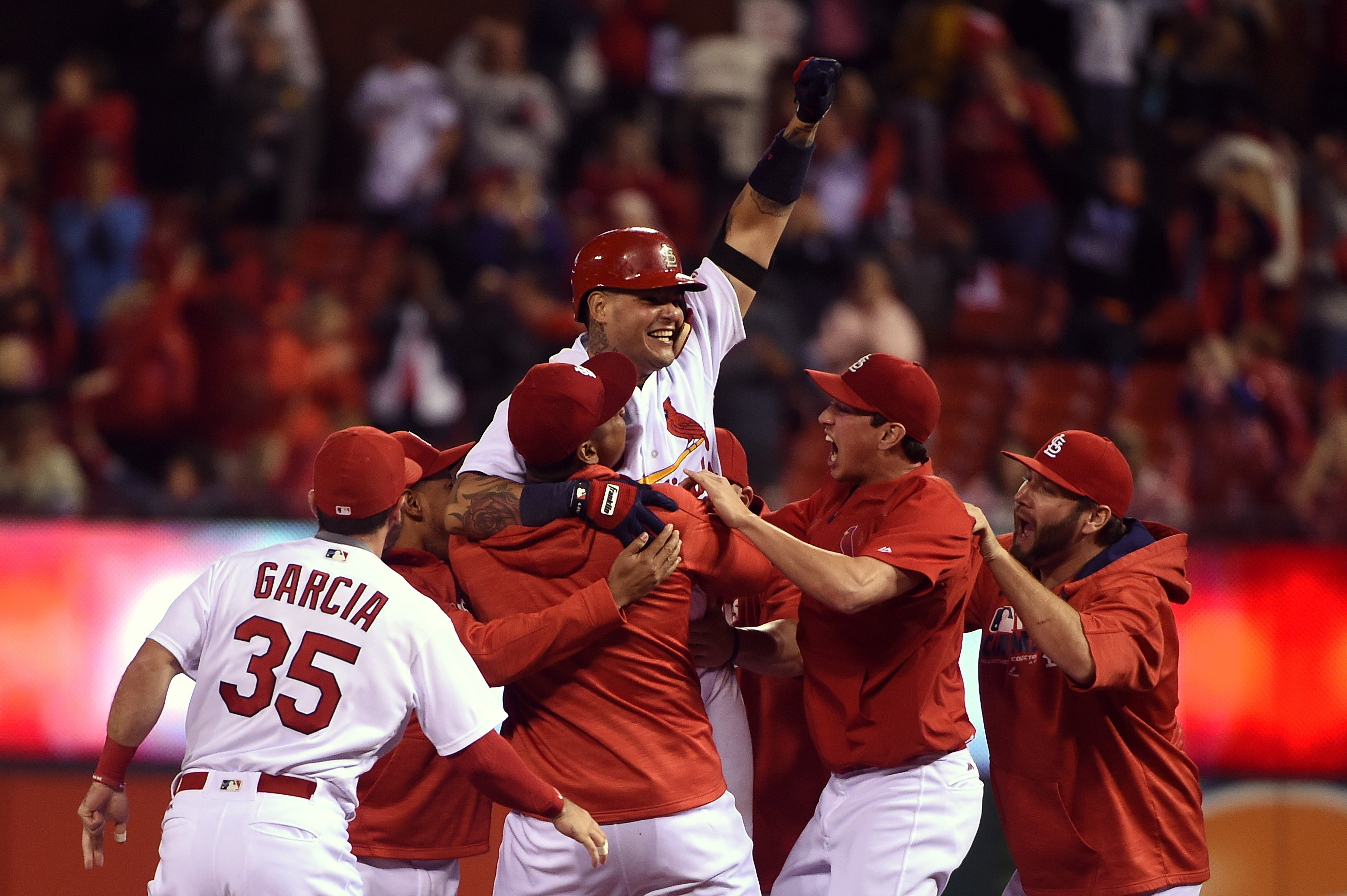 St. Louis Cardinals catcher Yadier Molina runs into Cincinnati