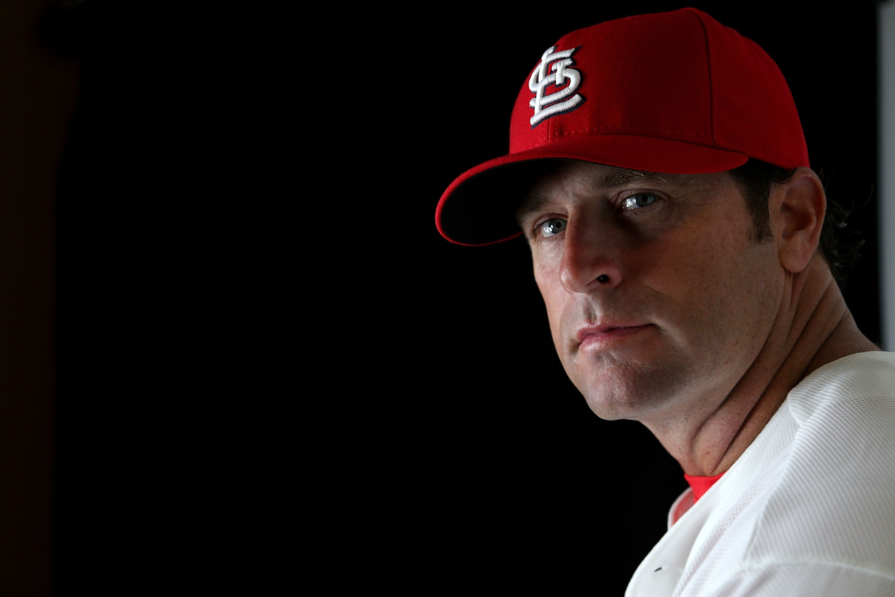 St. Louis Cardinals manager Mike Matheny holds up the championship trophy  after Game 6 of the National League baseball championship series against  the Los Angeles Dodgers Friday, Oct. 18, 2013, in St.